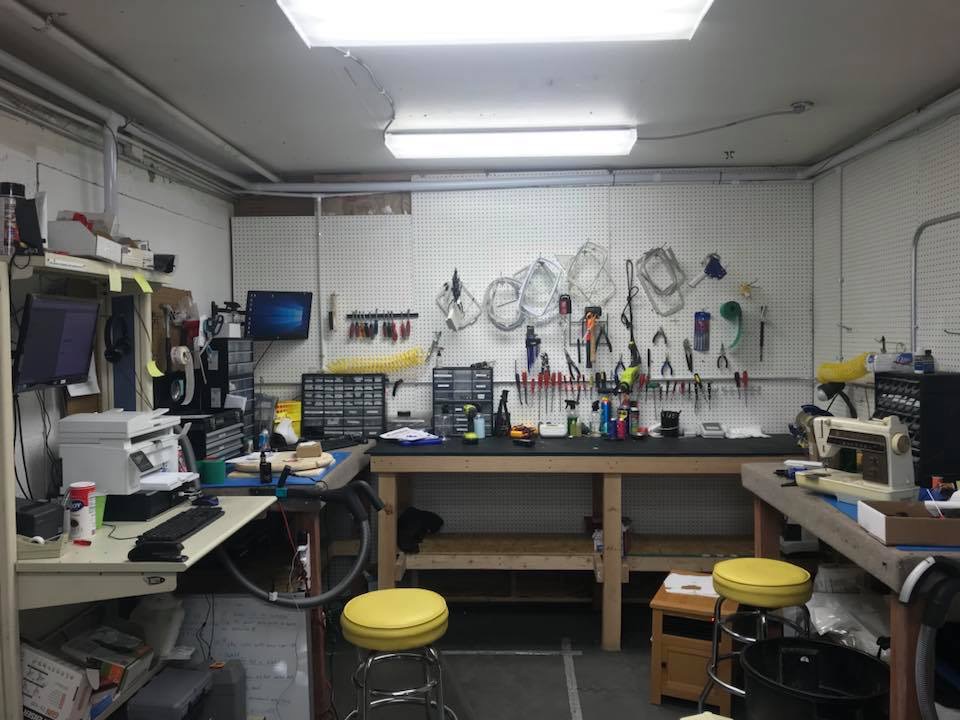 sewing machine repair shop showing tools